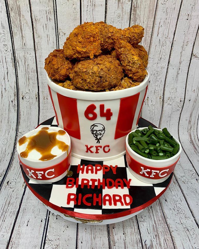 A birthday cake shaped like a bucket of fried chicken with sides