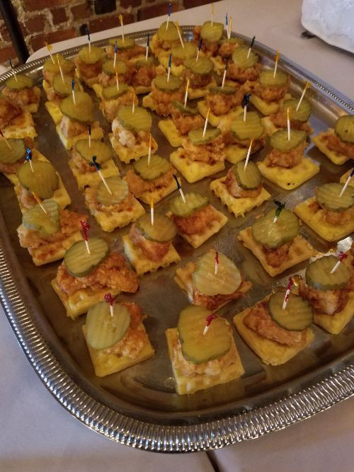 A tray of skewered appetizers